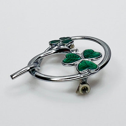 Side profile of vintage Mizpah green enamel shamrock brooch showing dimensional design.