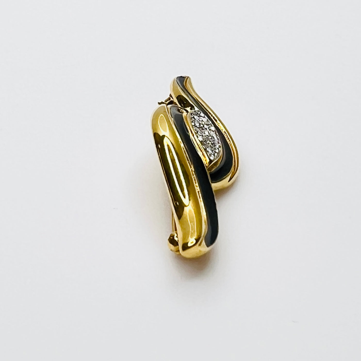 Side profile of vintage Monet rhinestone and enamel bar brooch