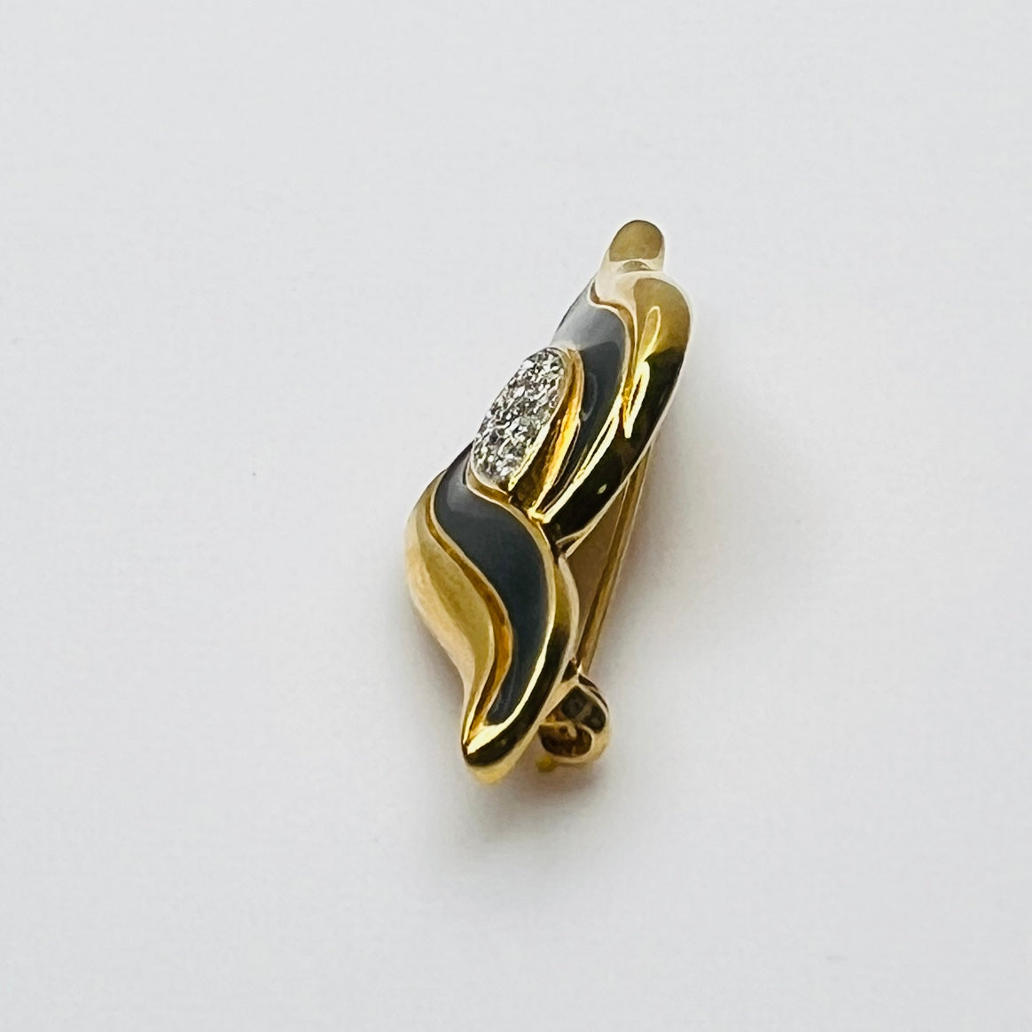 Side profile of vintage Monet rhinestone and enamel bar brooch