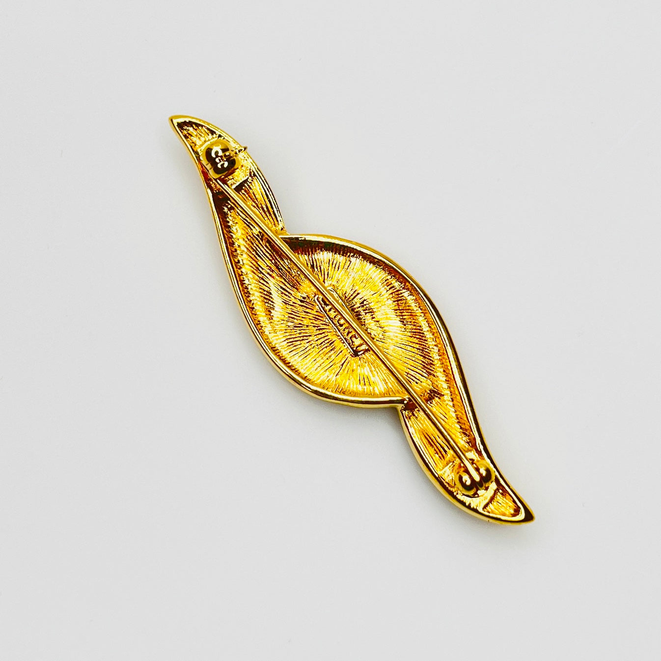 Back of signed Monet brooch showing rollover clasp closure