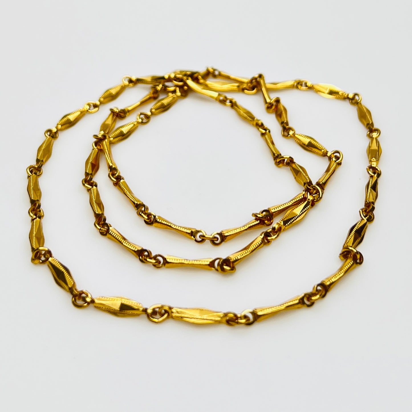 Gold textured link chain necklace flat lay vintage Monet