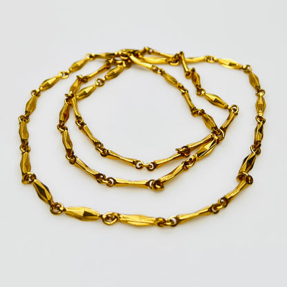 Gold textured link chain necklace flat lay vintage Monet
