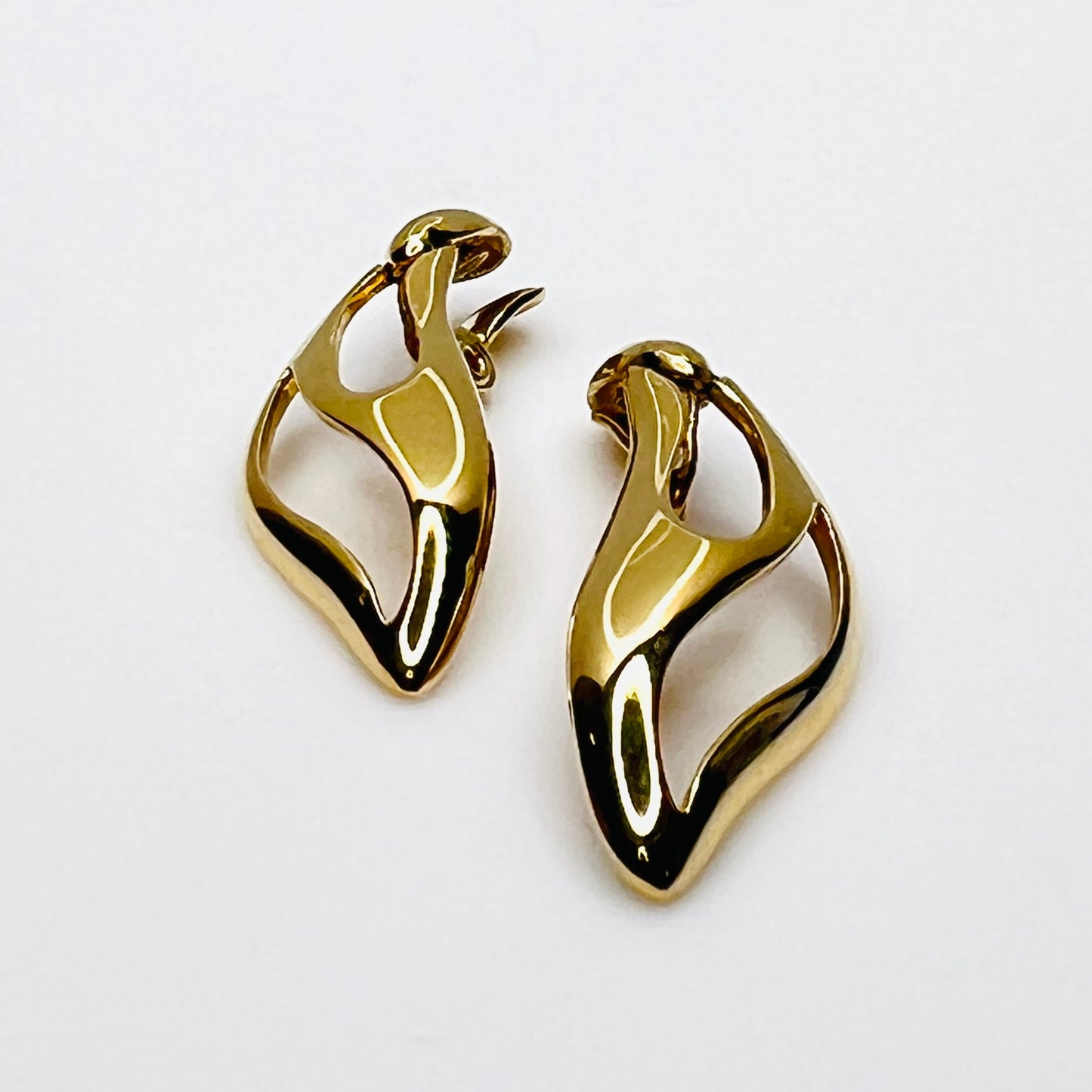 Side profile of vintage Monet sculptural gold-tone clip-on earrings