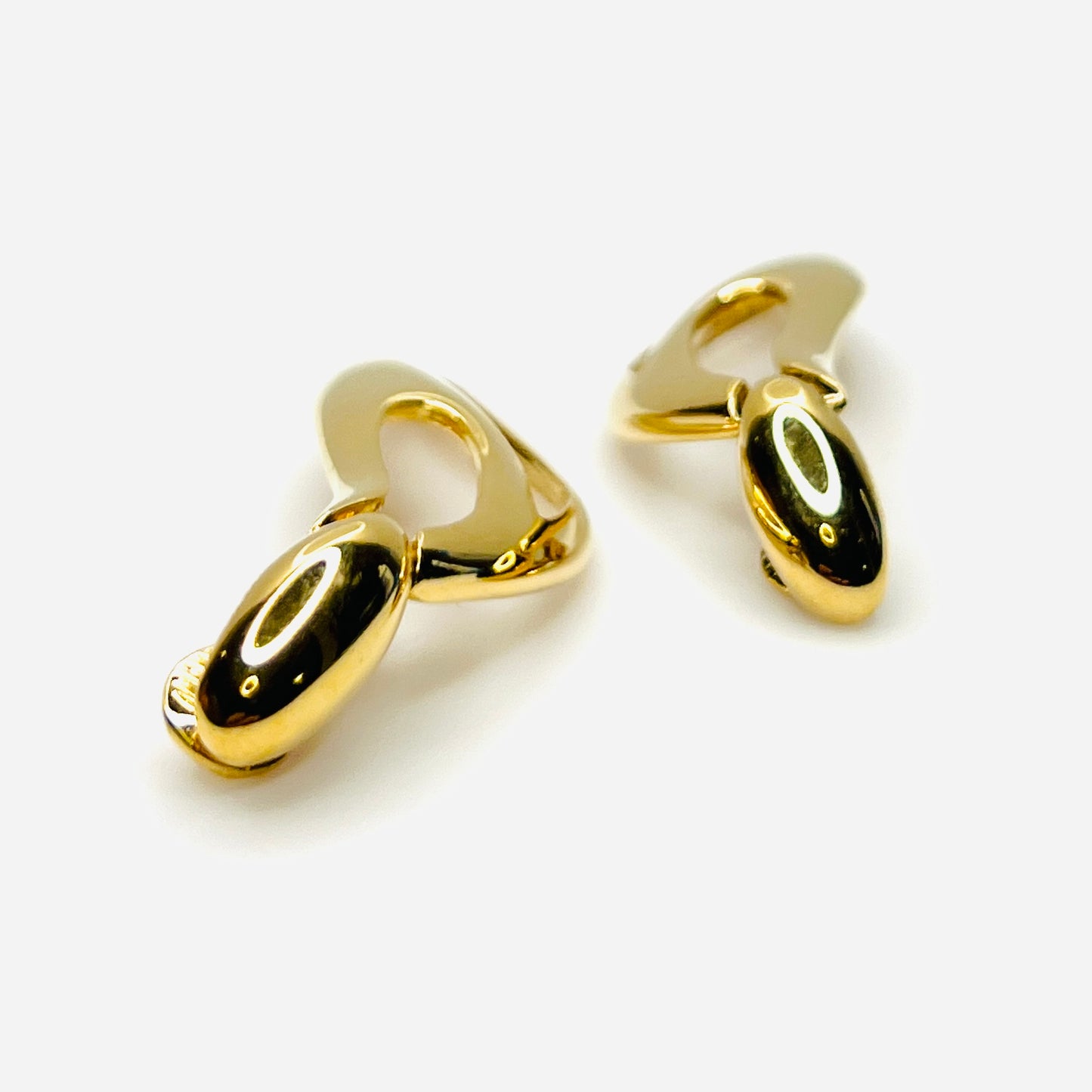 Side profile of vintage Monet sculptural gold-tone clip-on earrings