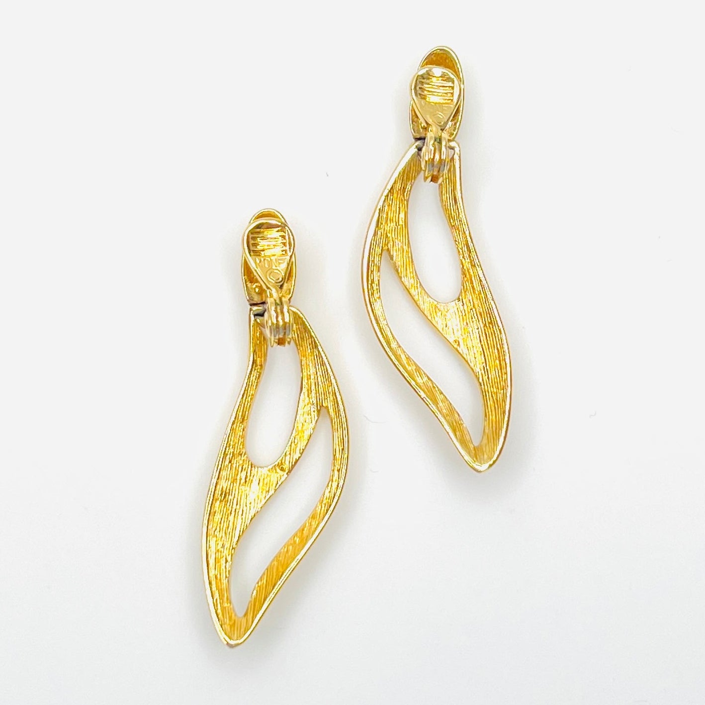 Back view of signed Monet 1980s gold-tone clip-on earrings
