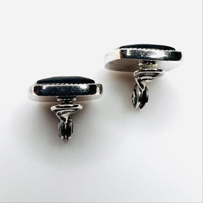 Side view of vintage Monet inlay clip-on earrings showing silver-tone clips