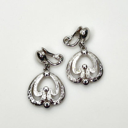 Vintage Monet silver tone abstract dangle clip-on earrings from the 1960s