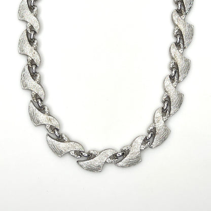 Vintage Monet silver tone textured swirl link choker necklace from the 1960s