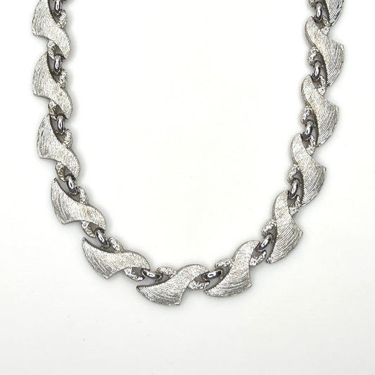 Vintage Monet silver tone textured swirl link choker necklace from the 1960s