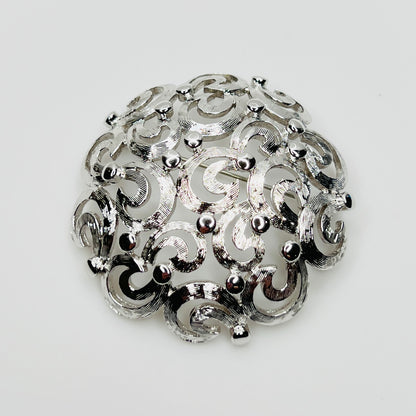 Vintage Monet silver tone swirl dome brooch filigree design