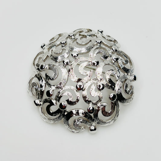 Vintage Monet silver tone swirl dome brooch filigree design