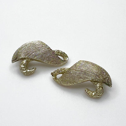 Vintage Monet pale gold tone brushed swirl clip-on earrings from the 1950s