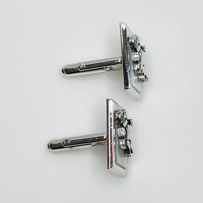 Rectangular silver cufflinks with mother of pearl inlay and raised silver lion motif