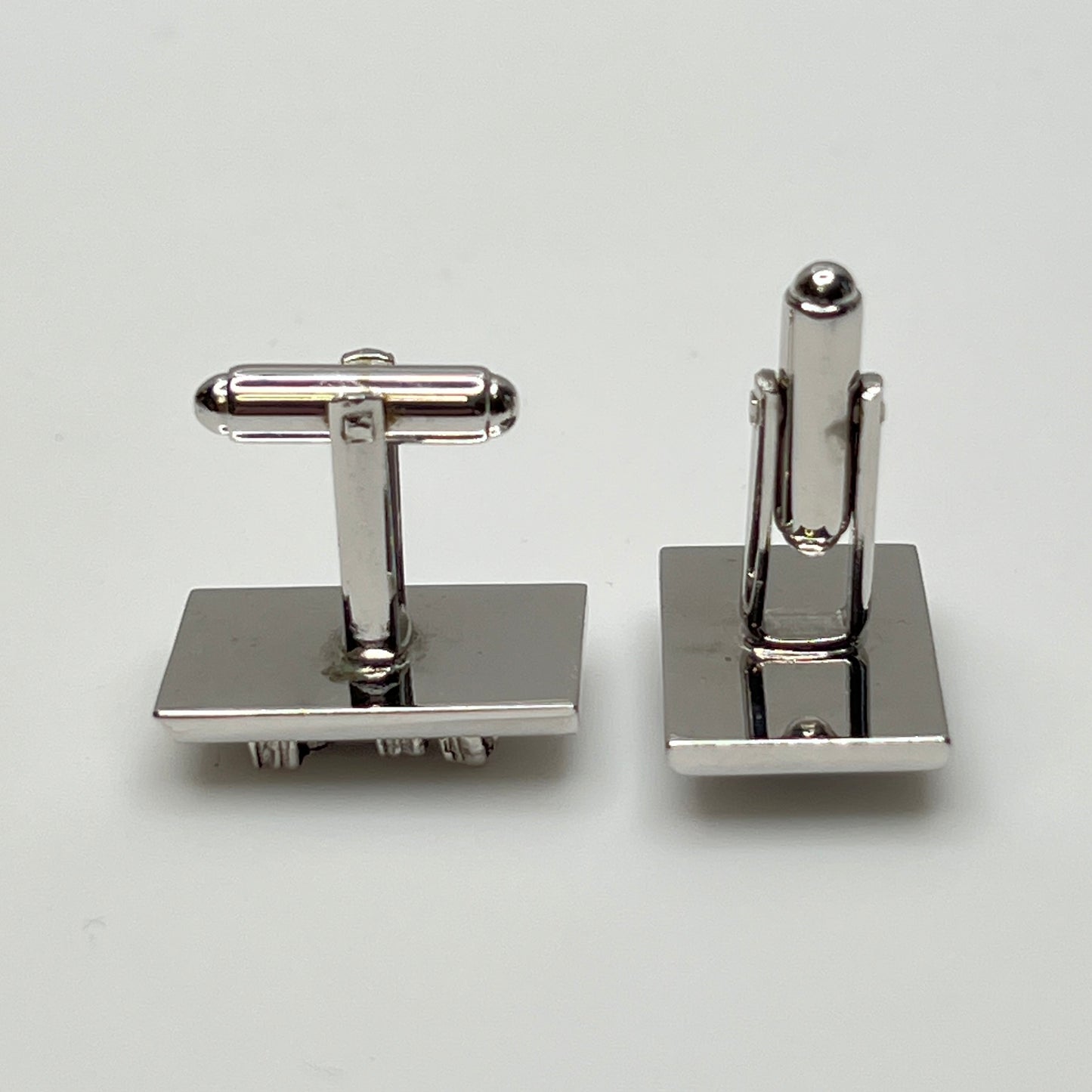 Rectangular silver cufflinks with mother of pearl inlay and raised silver lion motif