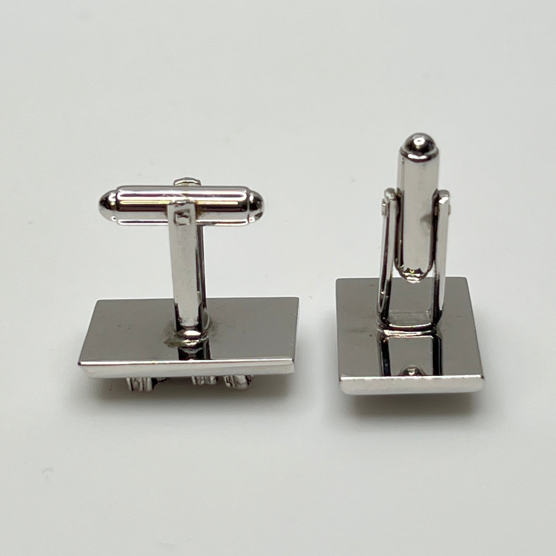 Rectangular silver cufflinks with mother of pearl inlay and raised silver lion motif