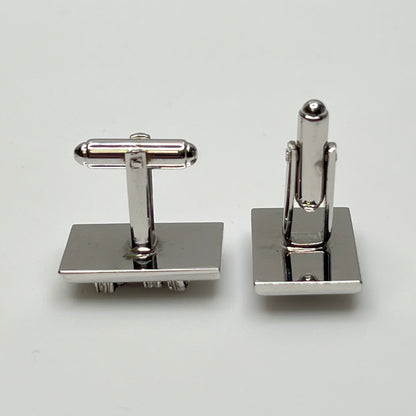 Rectangular silver cufflinks with mother of pearl inlay and raised silver lion motif