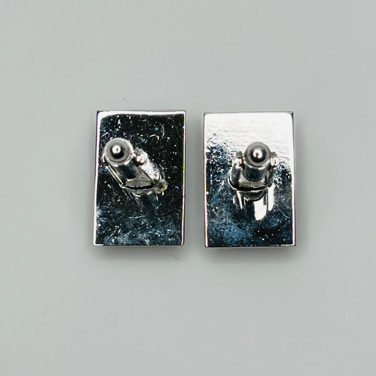 Rectangular silver cufflinks with mother of pearl inlay and raised silver lion motif