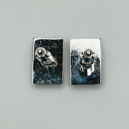 Rectangular silver cufflinks with mother of pearl inlay and raised silver lion motif