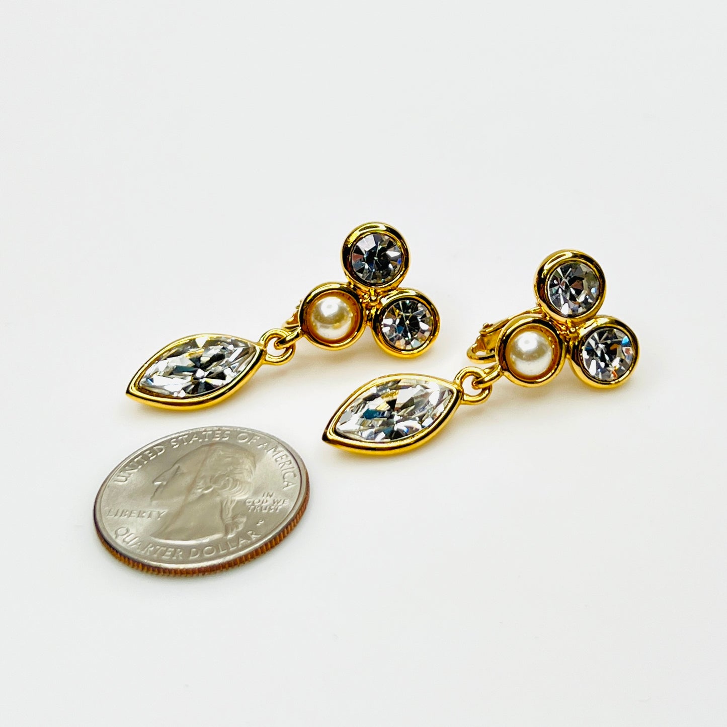 Napier rhinestone and faux pearl dangle clip-on earrings with quarter for scale