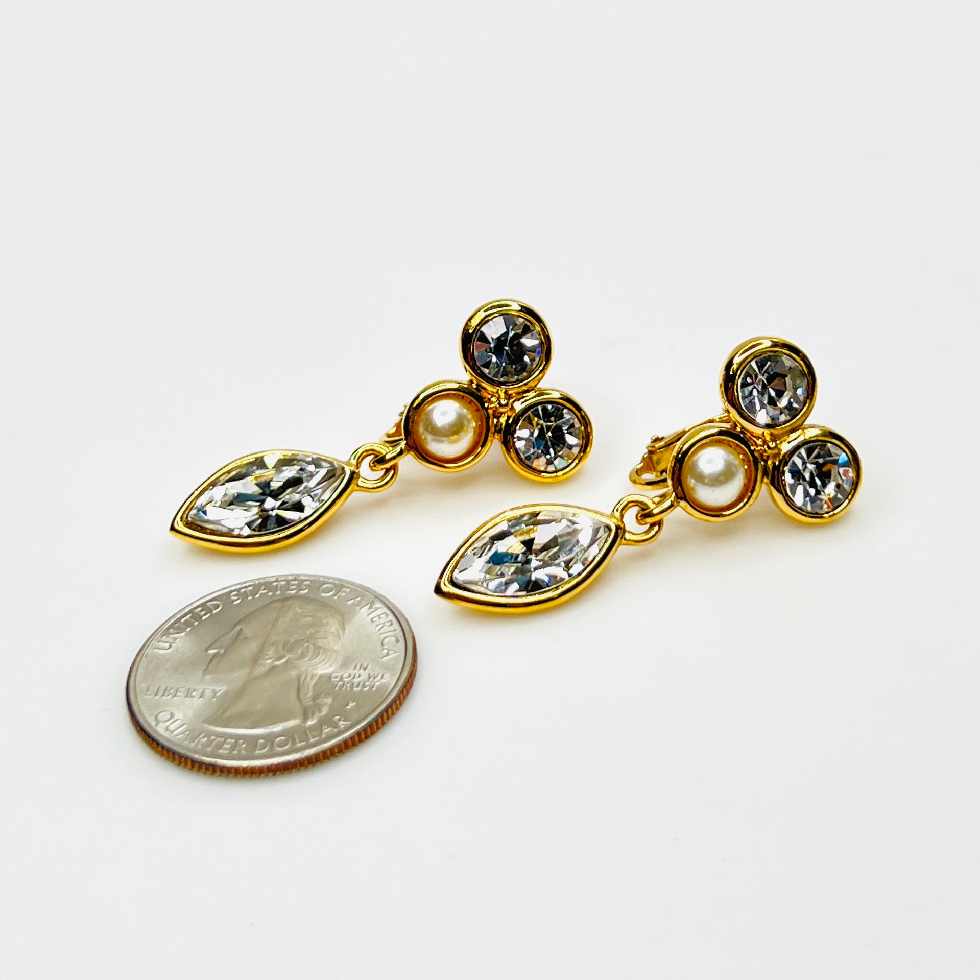 Napier rhinestone and faux pearl dangle clip-on earrings with quarter for scale