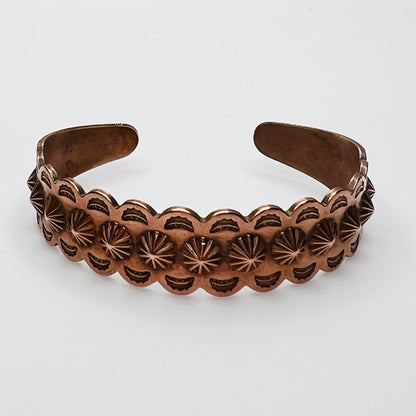 Vintage Southwestern copper cuff bracelet with stamped concho design