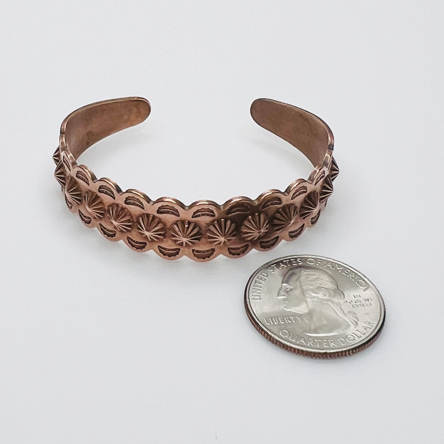Side view of vintage copper Southwestern cuff bracelet