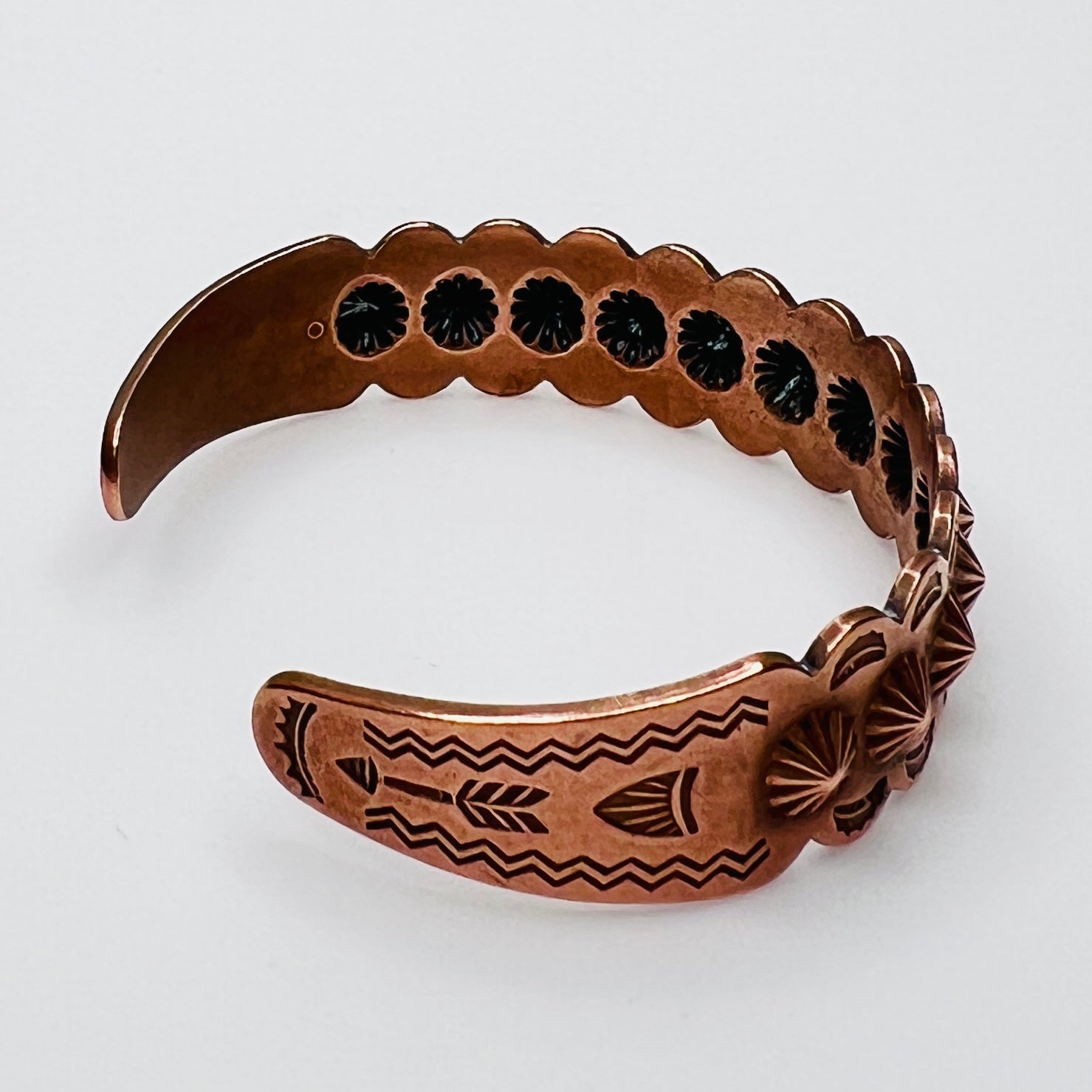 Side view of vintage copper Southwestern cuff bracelet