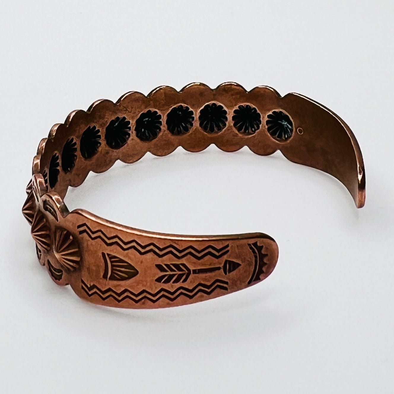 Side view of vintage copper Southwestern cuff bracelet