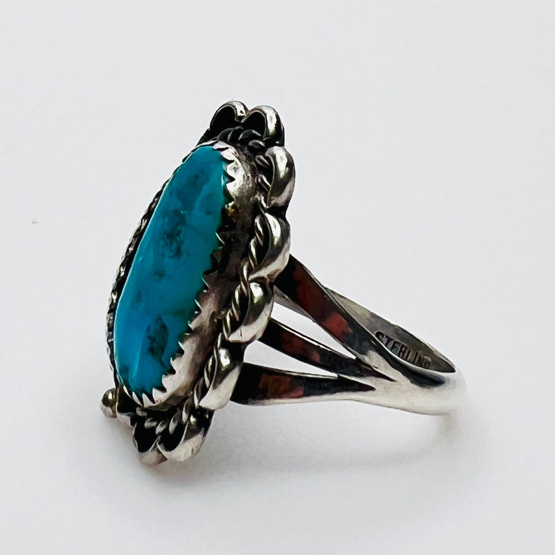 Side view of vintage sterling silver artisan turquoise ring