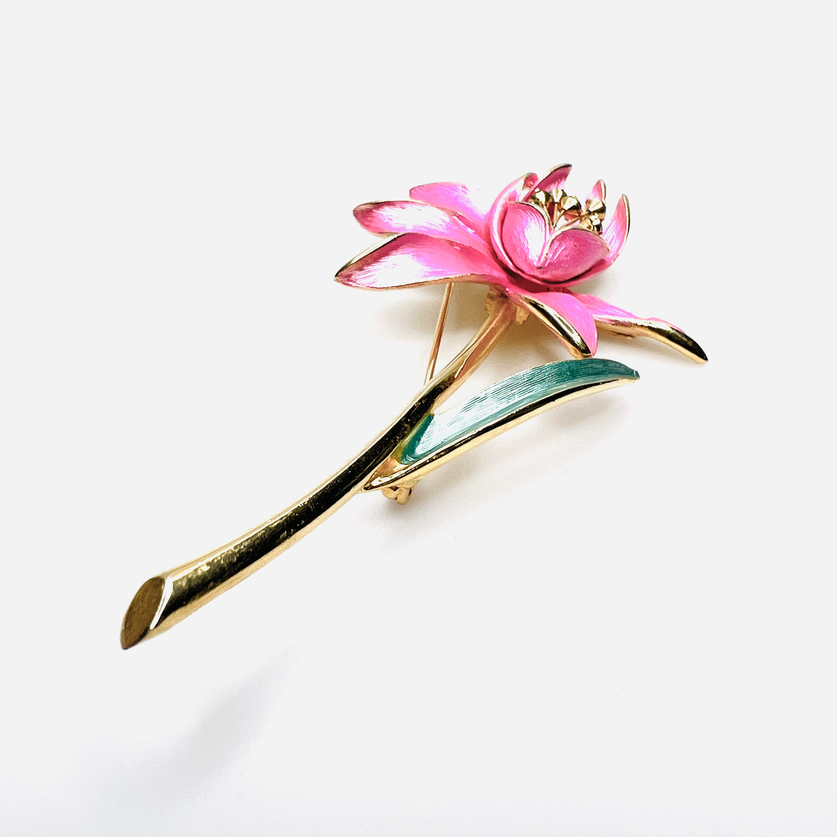 Side view of dimensional pink enamel flower brooch with layered petals and long gold stem