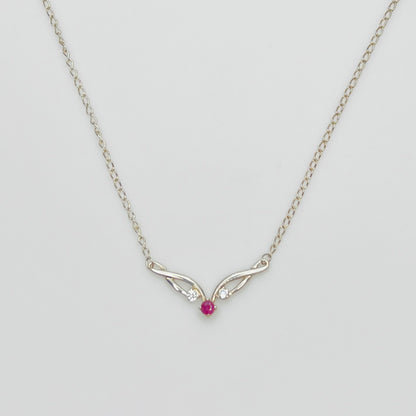 Sterling silver necklace with ruby center stone and CZ accents