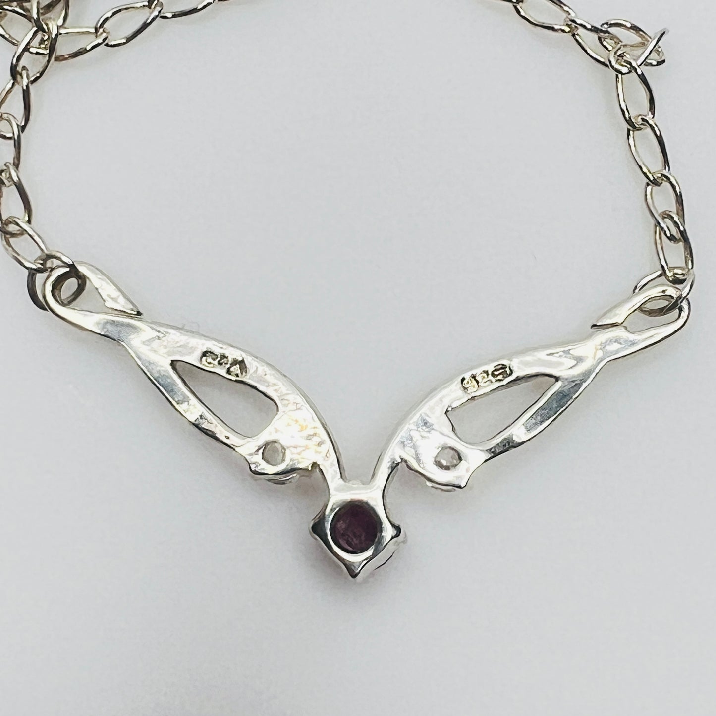 Back of pendant showing 925 and CA maker mark
