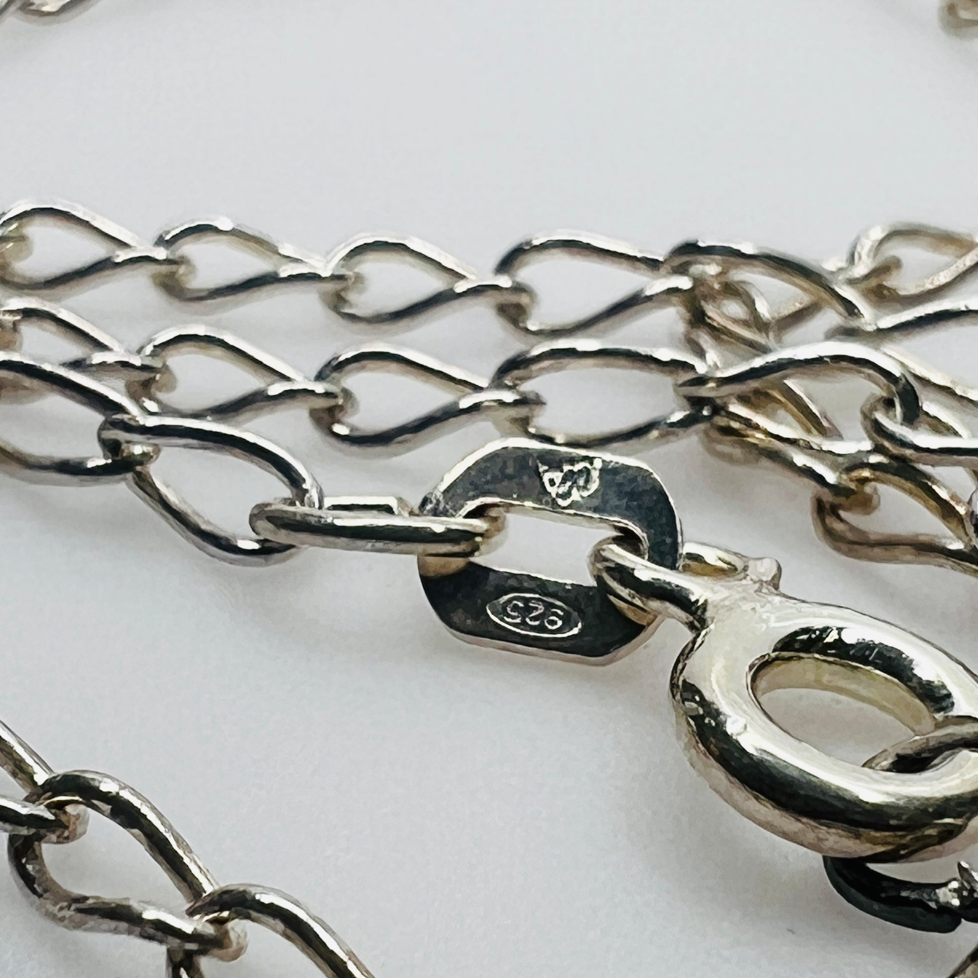 Clasp detail showing sterling silver stamp and makers mark on chain