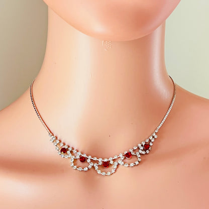 Silver tone rhinestone necklace with ruby red crystals