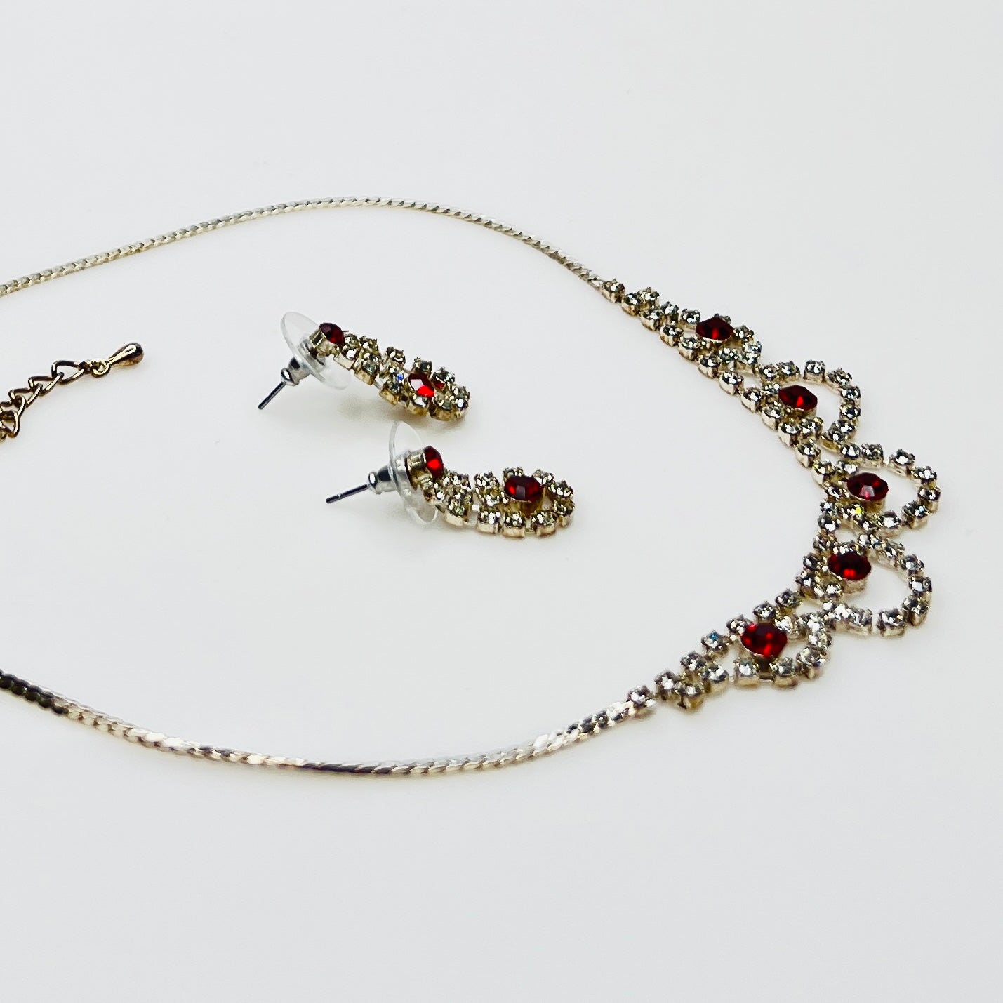 Silver tone rhinestone necklace with ruby red crystals