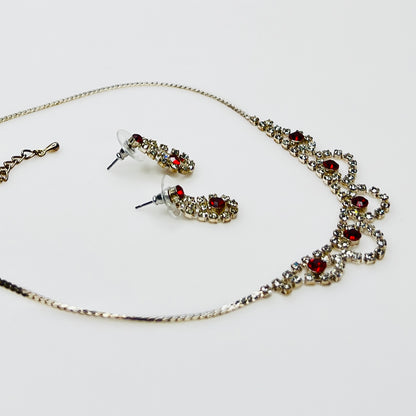 Silver tone rhinestone necklace with ruby red crystals