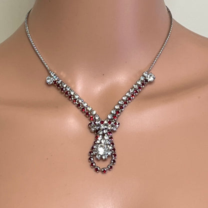 Ruby red and clear rhinestone vintage necklace worn on mannequin
