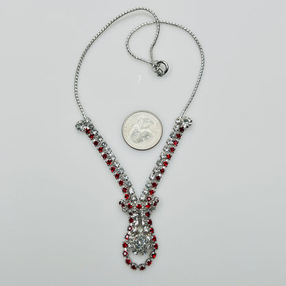 Vintage red and clear rhinestone necklace with quarter for scale, spring ring clasp