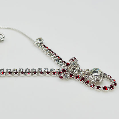 Close-up of 1950s V-shaped red rhinestone drop necklace