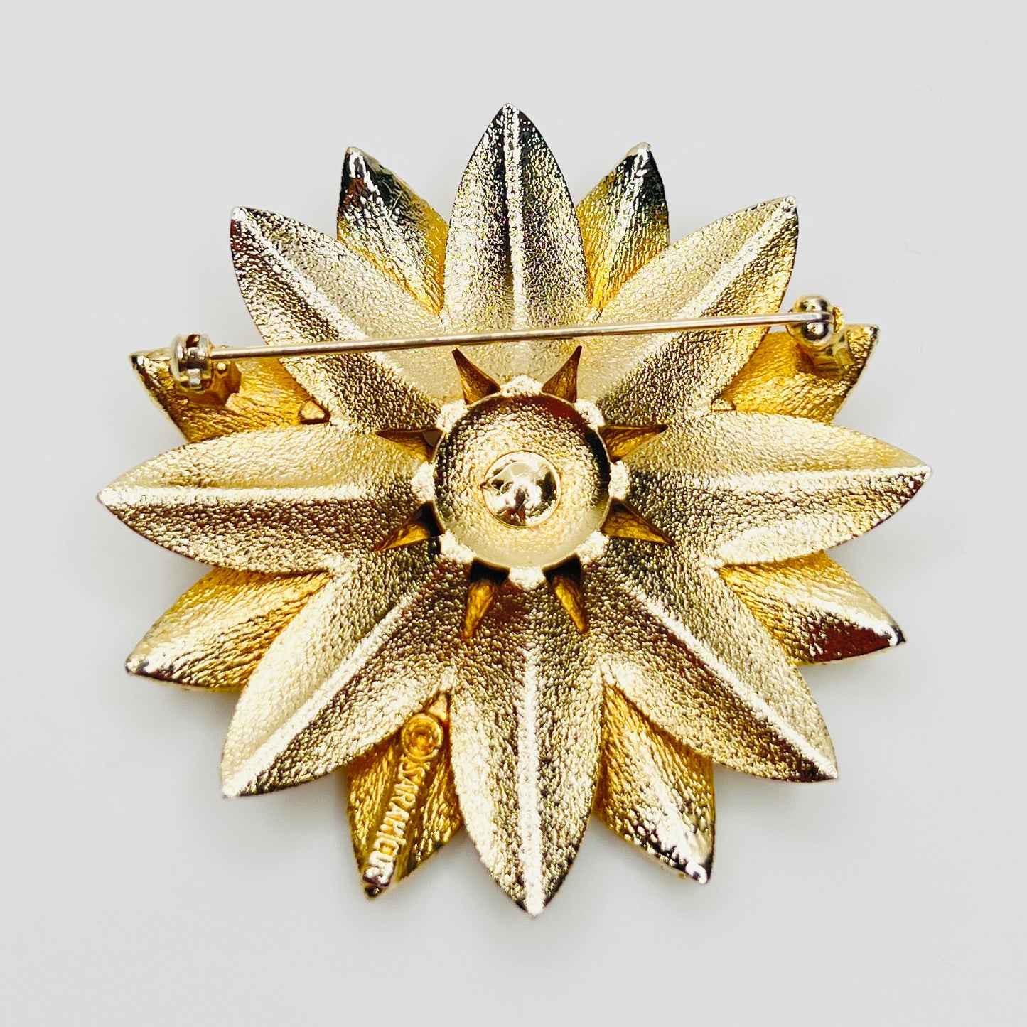 Reverse of signed Sarah Coventry brooch