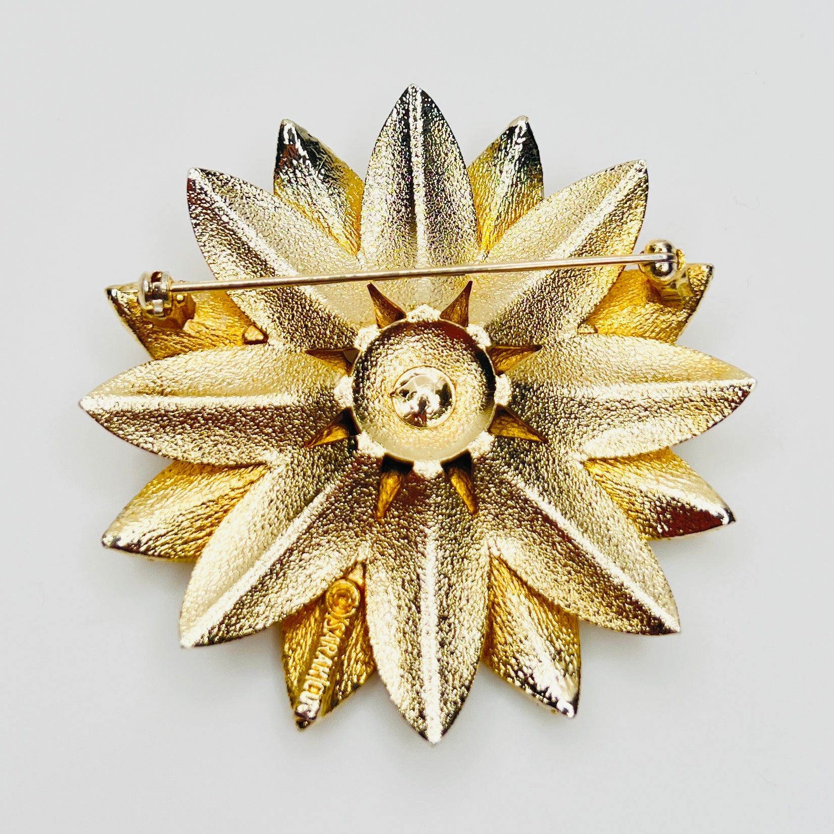 Reverse of signed Sarah Coventry brooch
