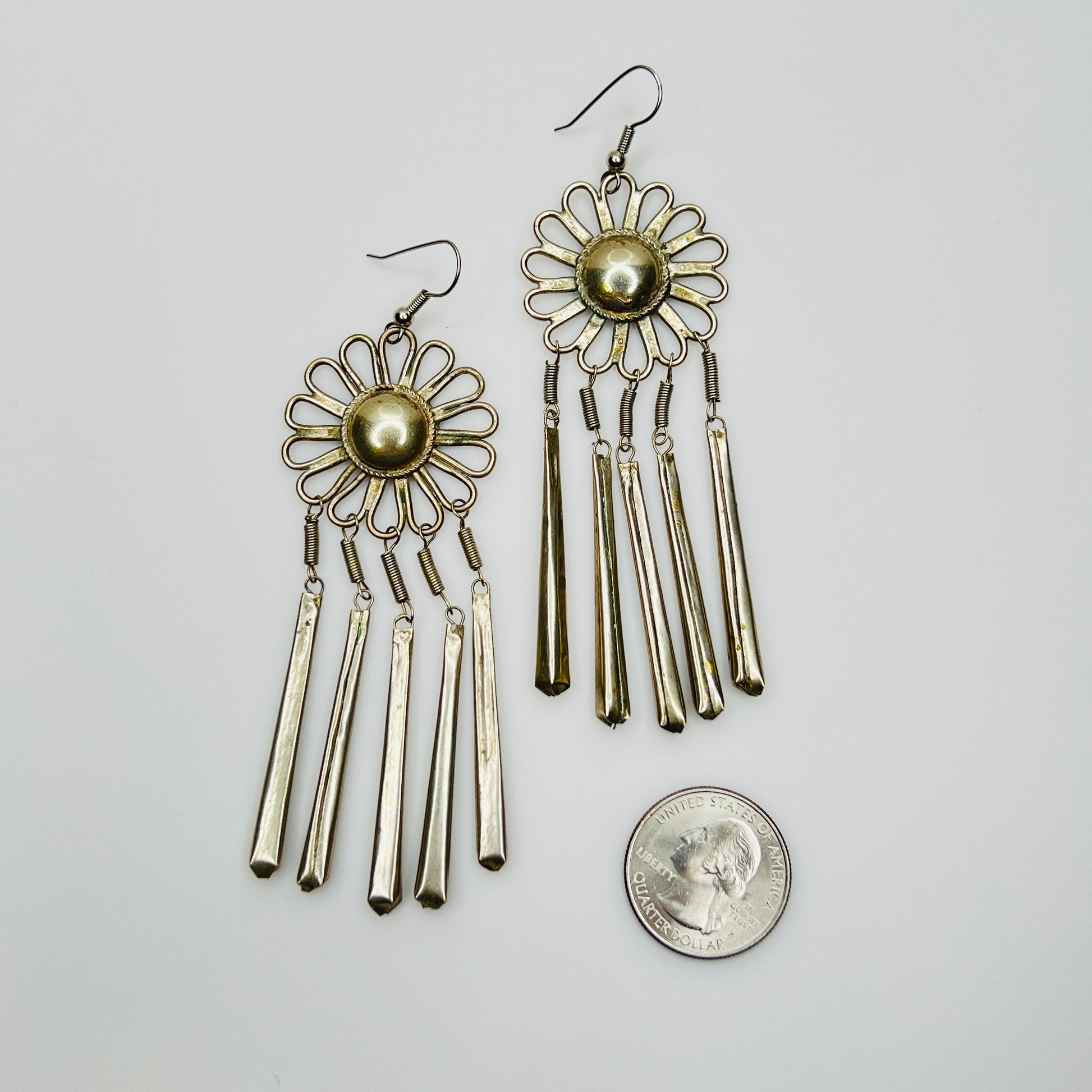 Vintage silver tone fringe earrings with quarter for size comparison