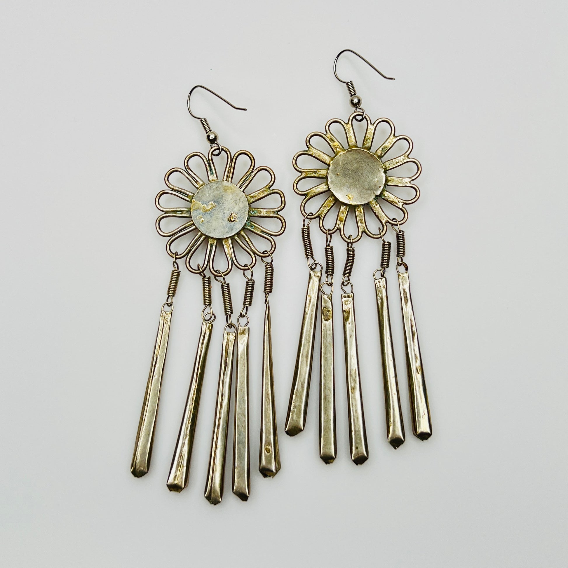 Back view ethnic flower earrings showing construction and patina