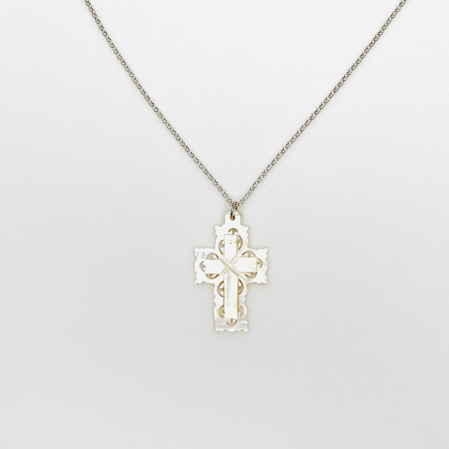 Vintage Bethlehem Mother of Pearl filigree cross pendant on sterling silver chain.
