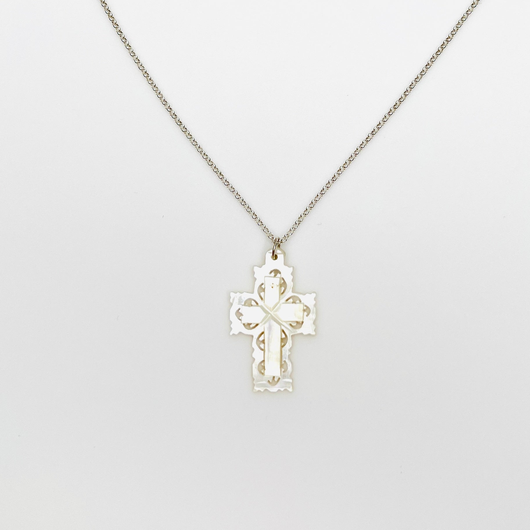 Vintage Bethlehem Mother of Pearl filigree cross pendant on sterling silver chain.