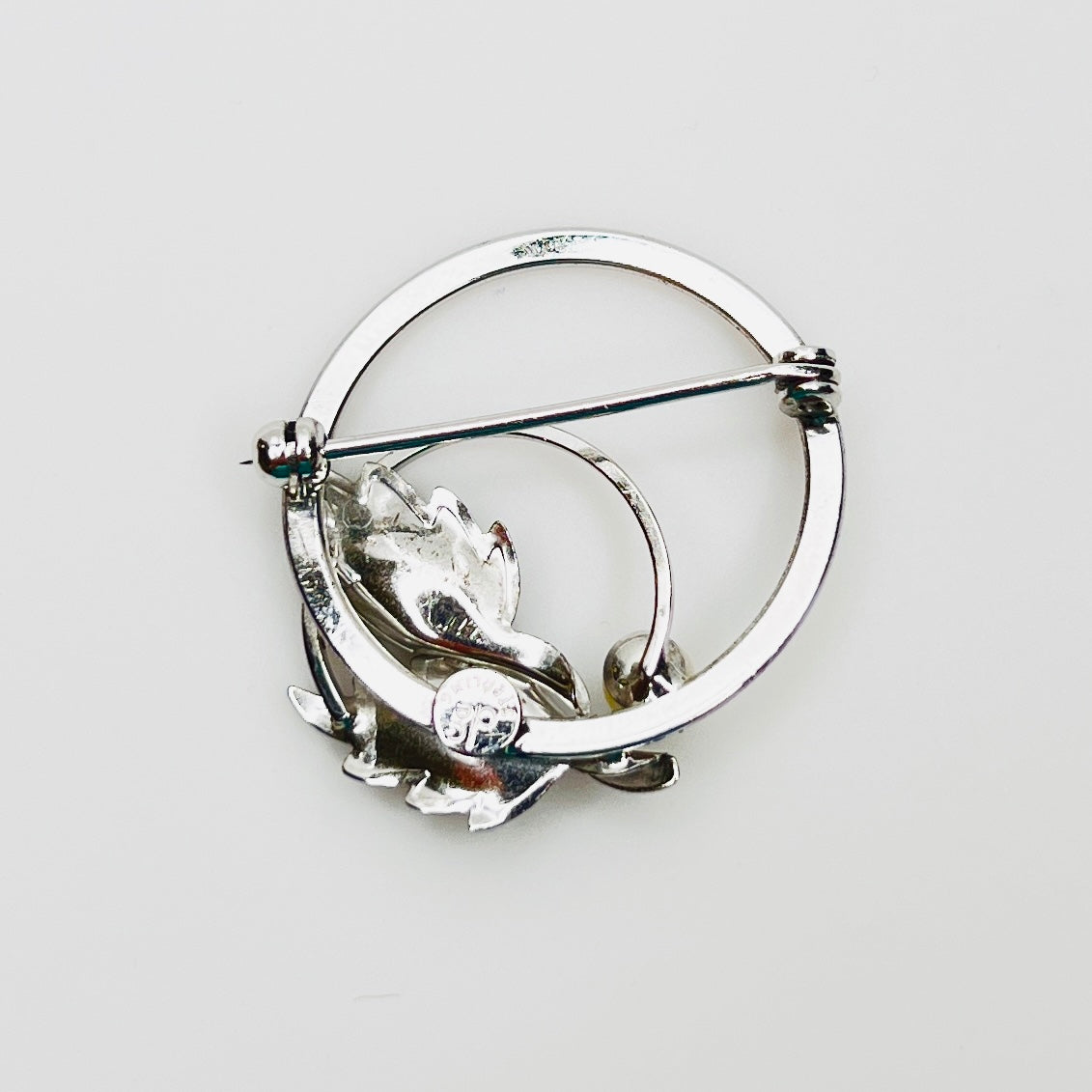 Reverse of signed DCE sterling silver brooch with safety clasp