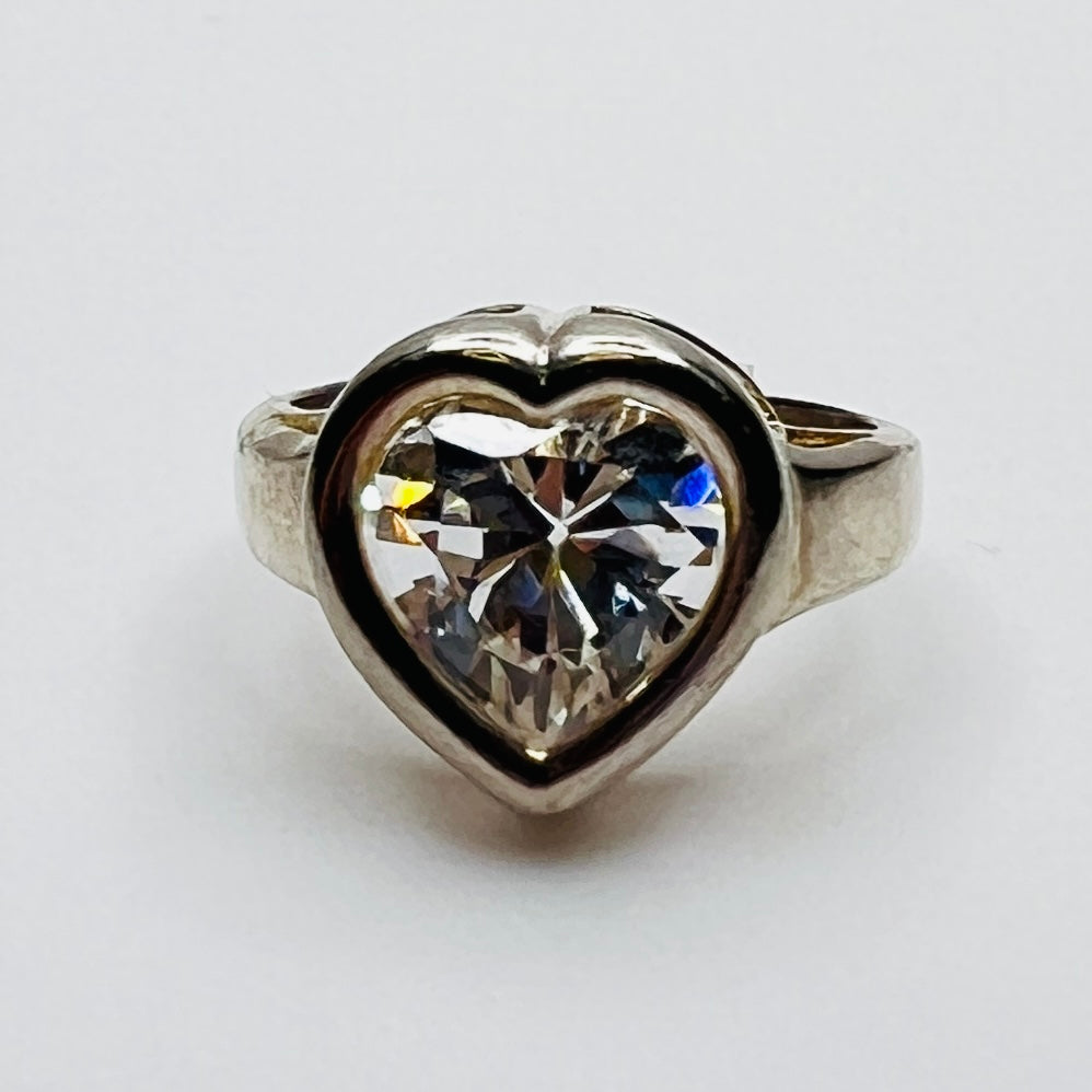 Close-up of heart-shaped CZ stone in silver setting