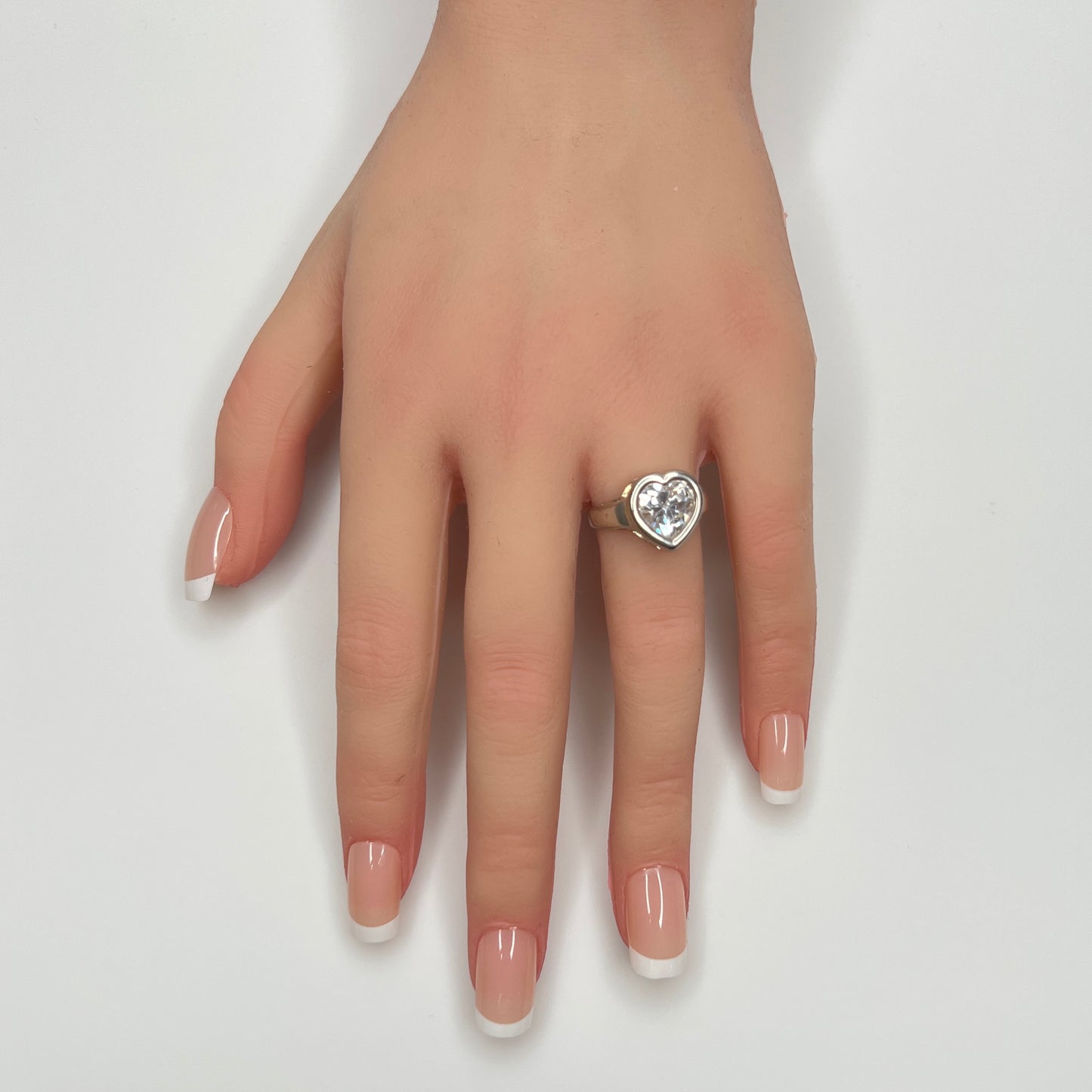 Sterling silver heart ring with clear cubic zirconia on hand