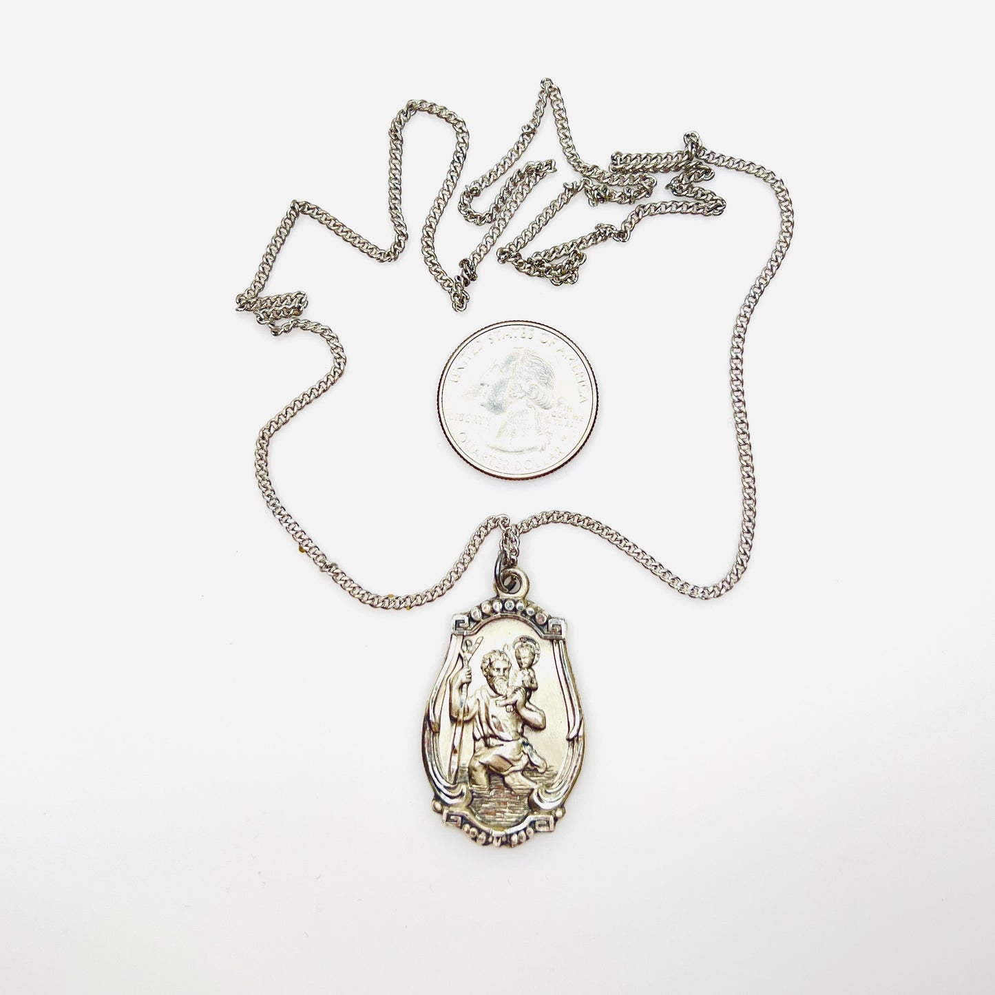 Hayward sterling St. Christopher medal necklace with quarter for scale.