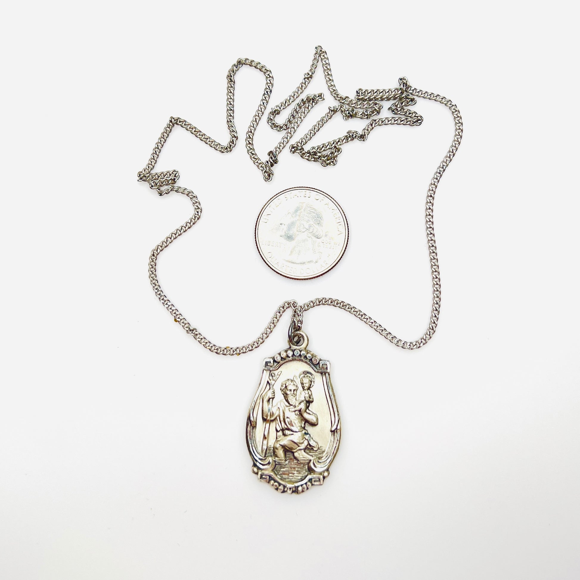 Hayward sterling St. Christopher medal necklace with quarter for scale.